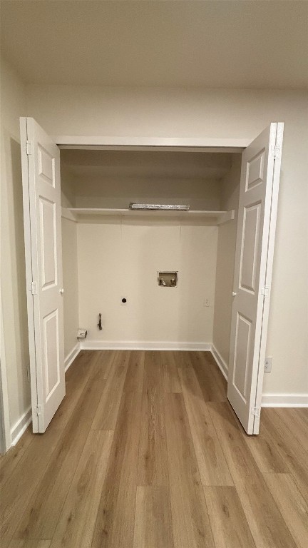 4507 Dorsett Oaks Circle, Unit A Austin, TX 78727 - Photo 3 of 26 Laundry room with wood finished floors, hookup for a electric dryer, washer hookup, and electric dryer hookup