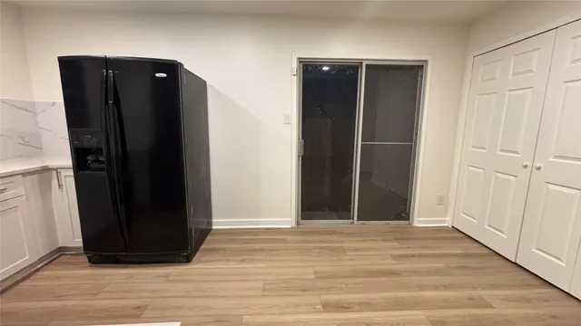 an empty room with wooden floor