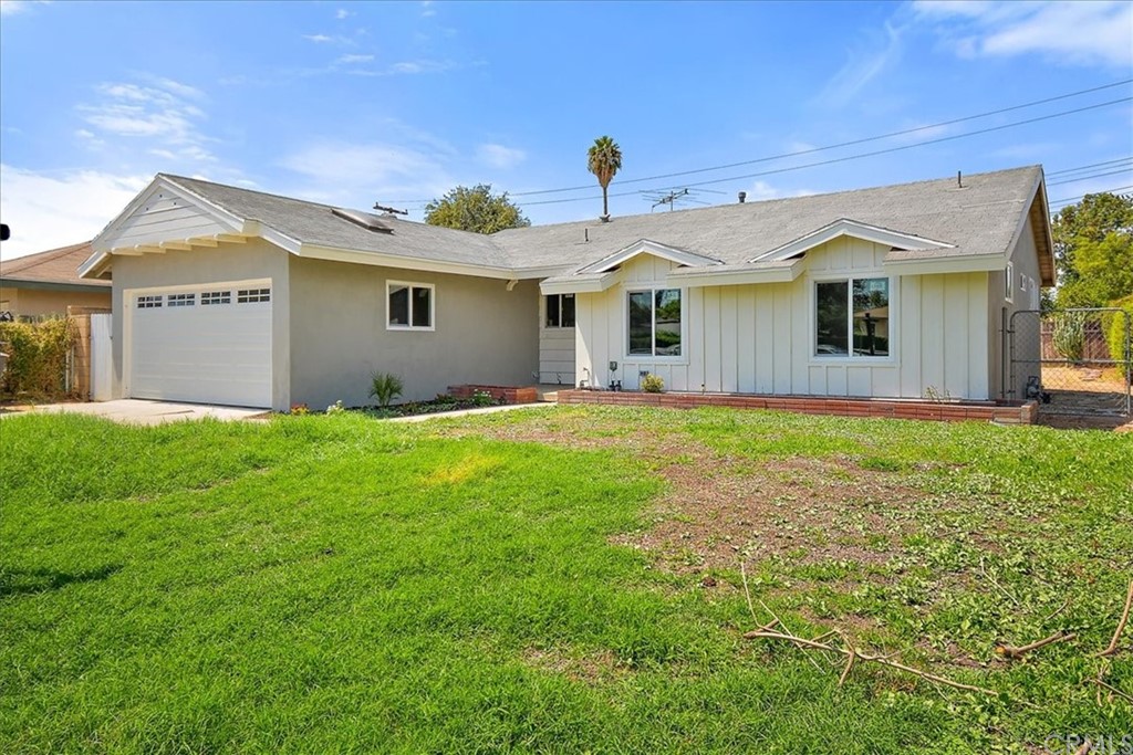 8775 Cellini Drive Riverside, CA 92503 - Photo 1 of 1 a front view of house with yard and green space