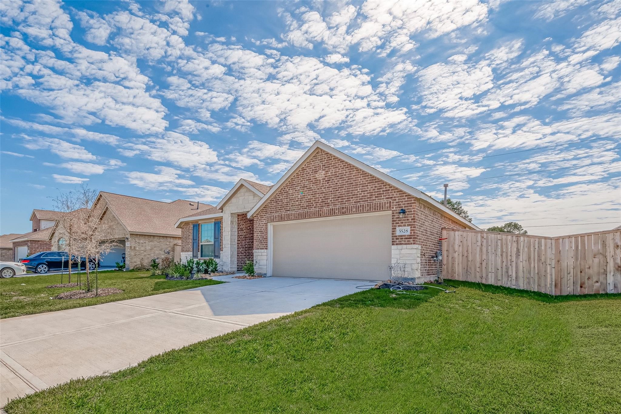 5528 Knox Landing Drive Rosenberg, TX 77469 - Photo 2 of 20 a view of a house with a small yard and a large tree