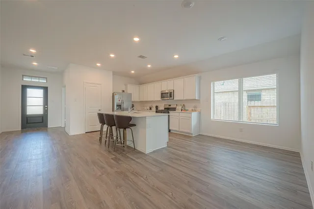a kitchen with a table and chairs in it