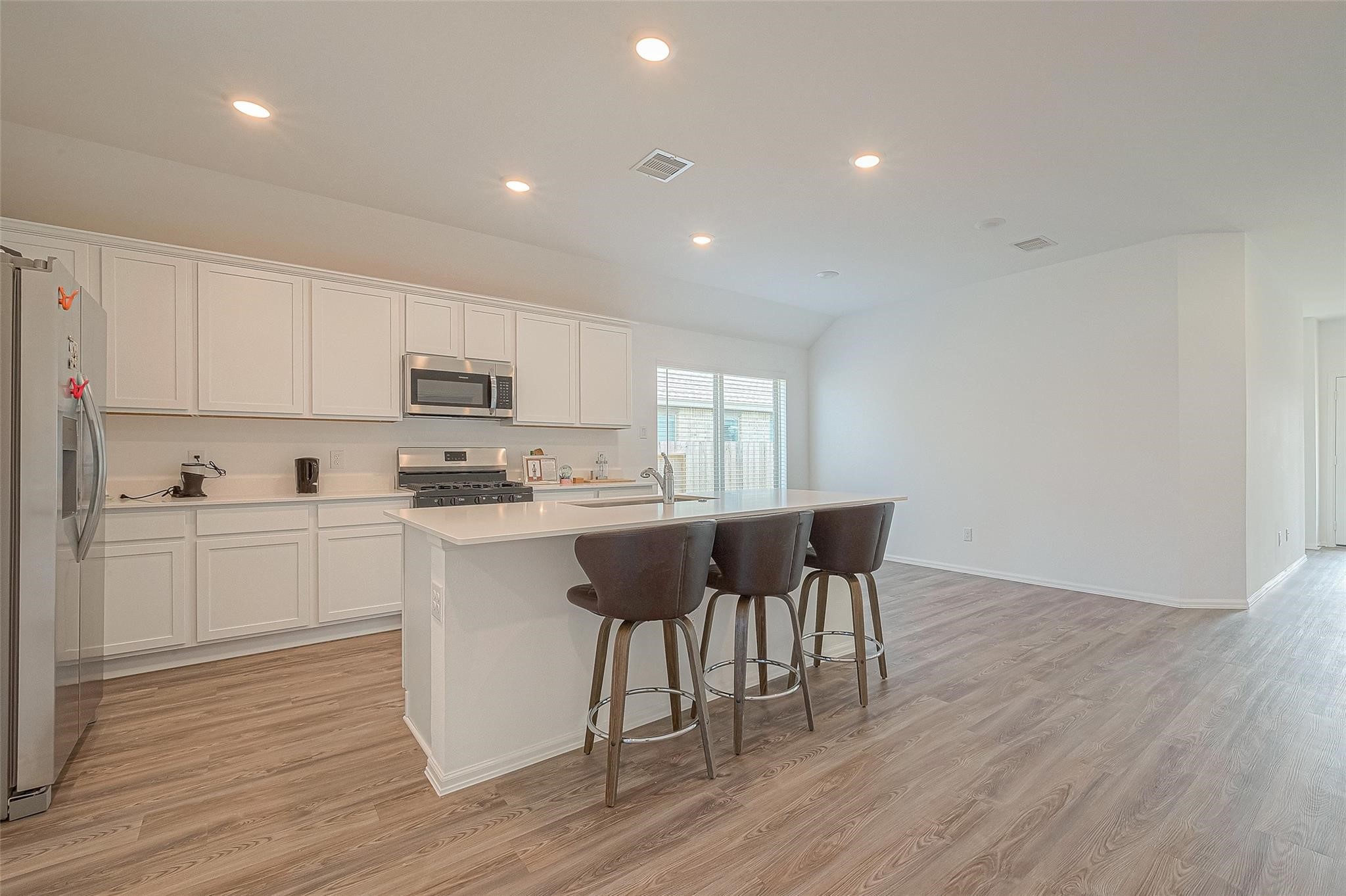 5528 Knox Landing Drive Rosenberg, TX 77469 - Photo 5 of 20 a kitchen with a sink cabinets and wooden floor