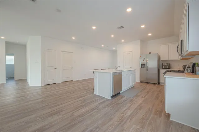 a view of kitchen with wooden floor