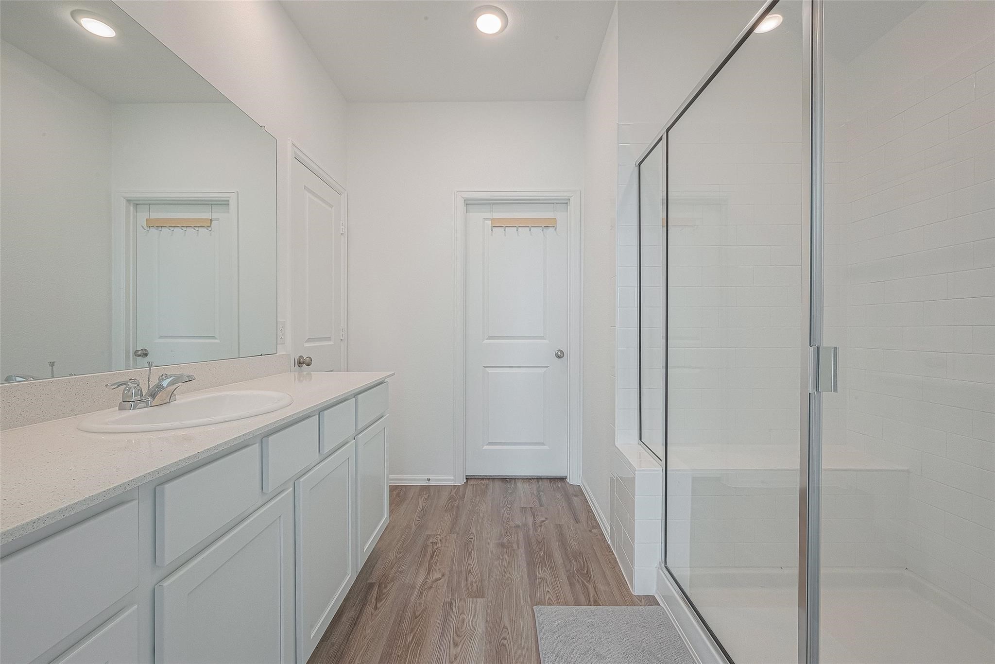 5528 Knox Landing Drive Rosenberg, TX 77469 - Photo 9 of 20 a spacious bathroom with a double vanity sink and mirror