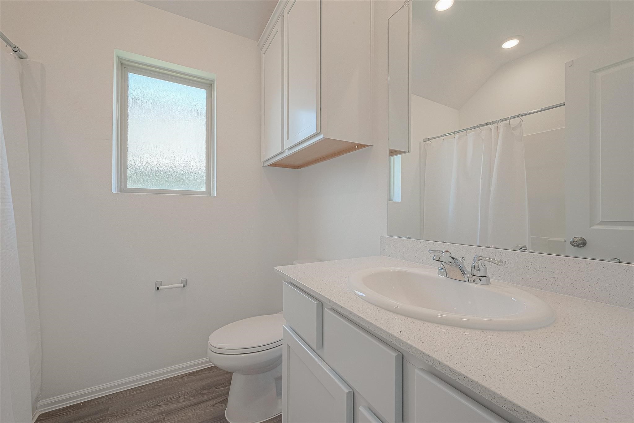 5528 Knox Landing Drive Rosenberg, TX 77469 - Photo 10 of 20 a bathroom with a sink toilet and vanity