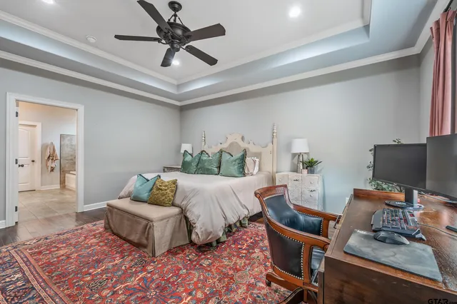 a bathroom with a granite countertop sink vanity and mirror