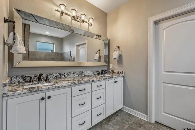 a bathroom with a tub and a shower
