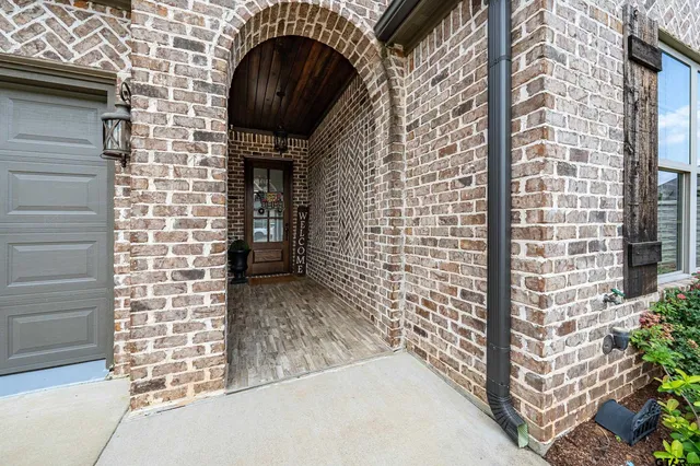 a view of room with window and furniture