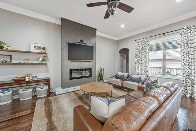 a living room with furniture and a flat screen tv