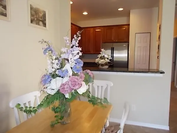 a kitchen with a table and chairs in it