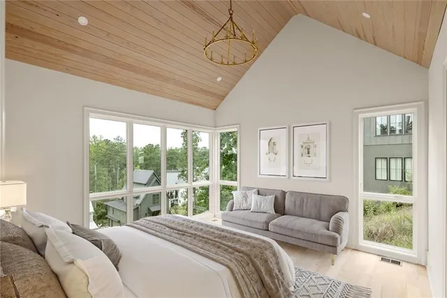 a bedroom with a large bed and a window