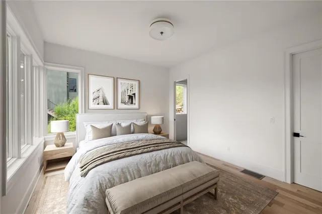 a bedroom with a bed and a couch