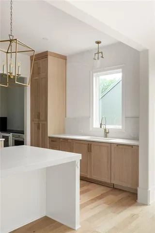 a spacious bathroom with a sink and a mirror