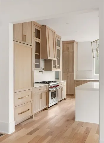 a kitchen with stainless steel appliances a stove and a refrigerator