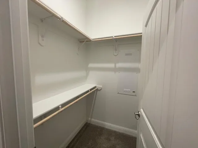 a empty closet with white paint