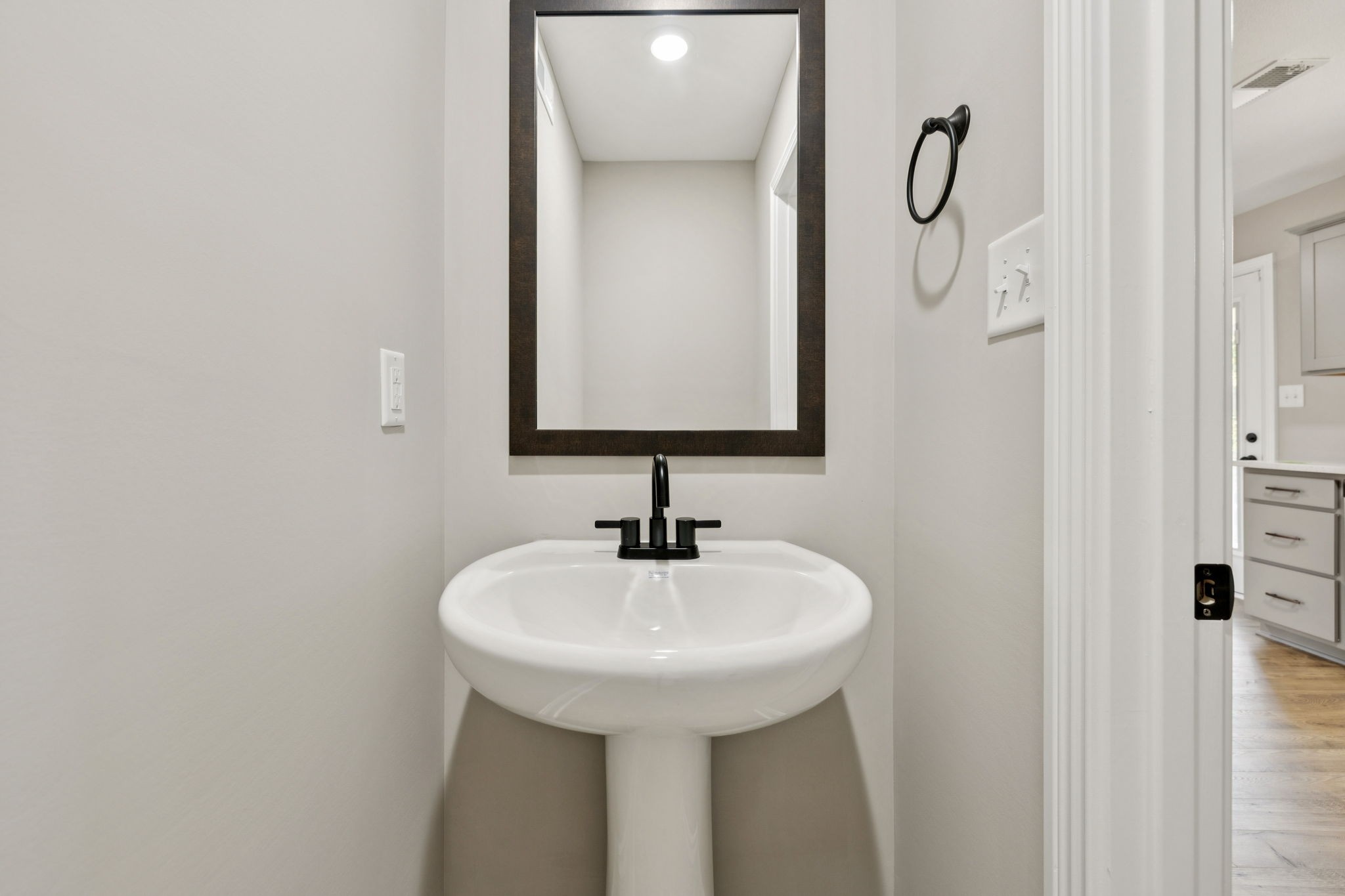 1304 Racker Drive Clarksville, TN 37043 - Photo 28 of 35 a bathroom with a sink and a mirror