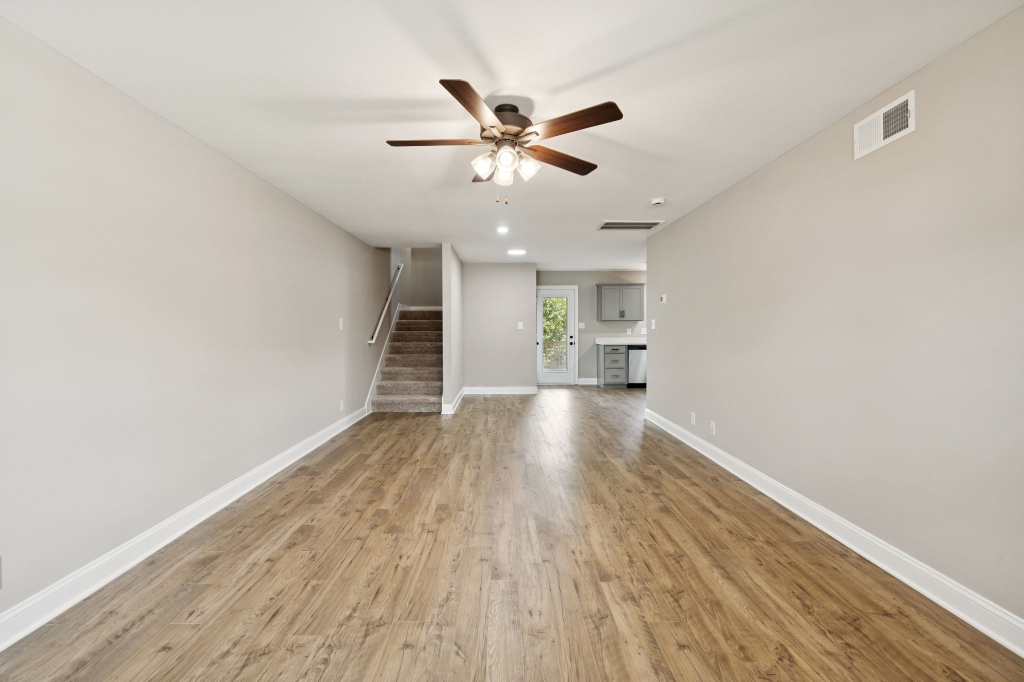 1304 Racker Drive Clarksville, TN 37043 - Photo 6 of 35 a view of empty room with wooden floor and ceiling fan