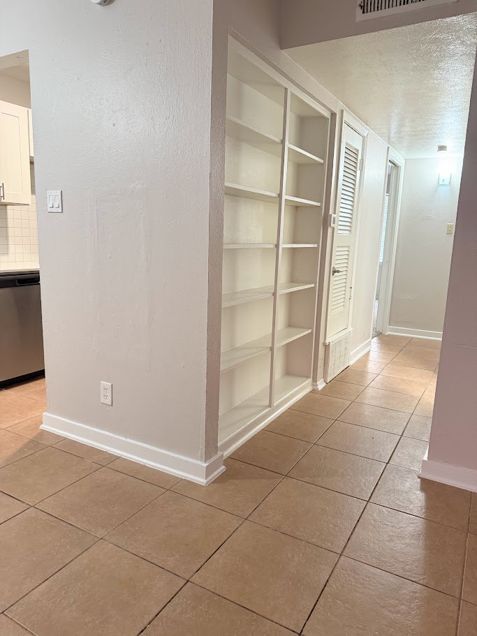 307 East 31st Street, Unit 106 Austin, TX 78705 - Photo 5 of 12 a view of an empty room with a window