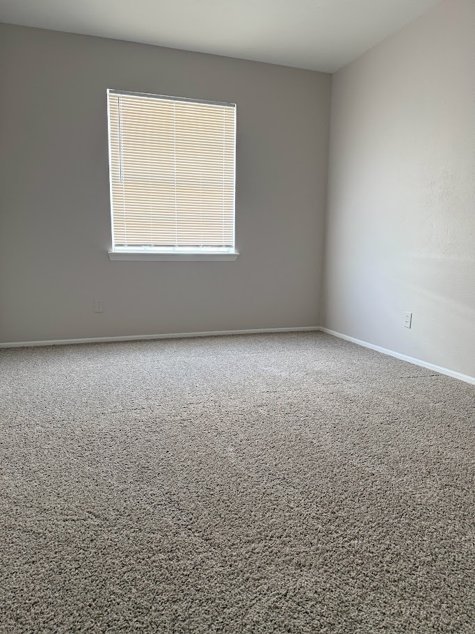 307 East 31st Street, Unit 106 Austin, TX 78705 - Photo 7 of 12 an empty room with a window