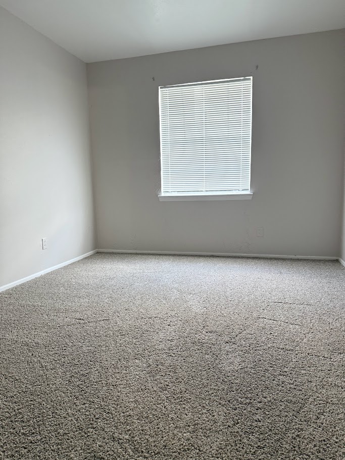 307 East 31st Street, Unit 106 Austin, TX 78705 - Photo 9 of 12 an empty room with a window