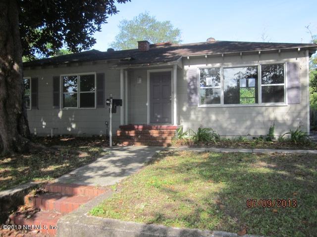 2452 Bayview Road Jacksonville, FL 32210 - Photo 1 of 14 a front view of a house with garden