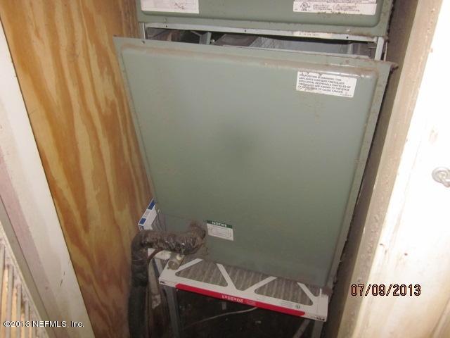 2452 Bayview Road Jacksonville, FL 32210 - Photo 14 of 14 a bathroom with a sink and a mirror