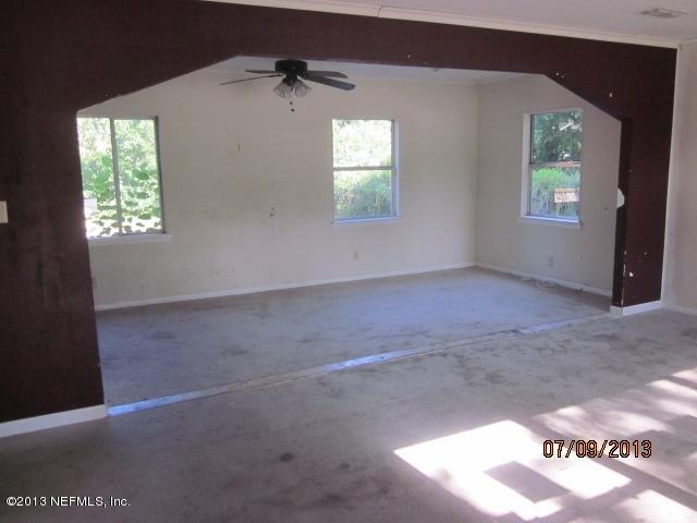 2452 Bayview Road Jacksonville, FL 32210 - Photo 4 of 14 an empty room that has a window
