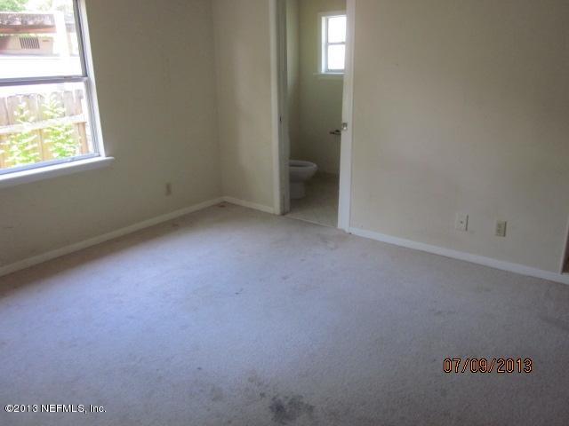 2452 Bayview Road Jacksonville, FL 32210 - Photo 8 of 14 an empty room with windows