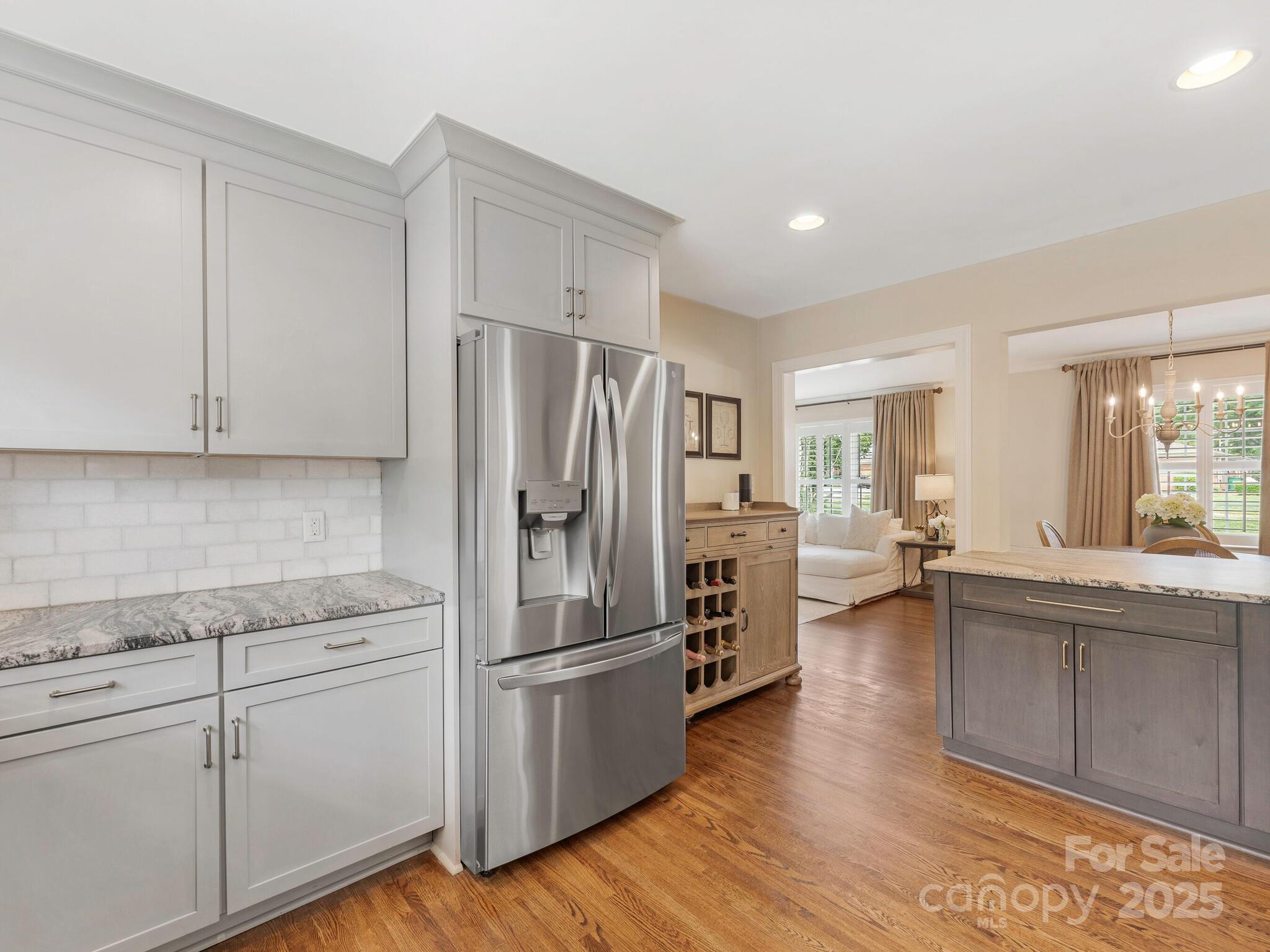 4346 Walker Road Charlotte, NC 28211 - Photo 13 of 30 a kitchen with a refrigerator and a sink