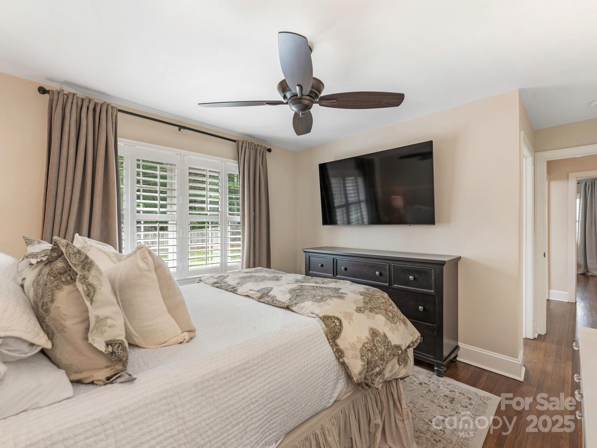 4346 Walker Road Charlotte, NC 28211 - Photo 17 of 30 a bedroom with a bed and a television