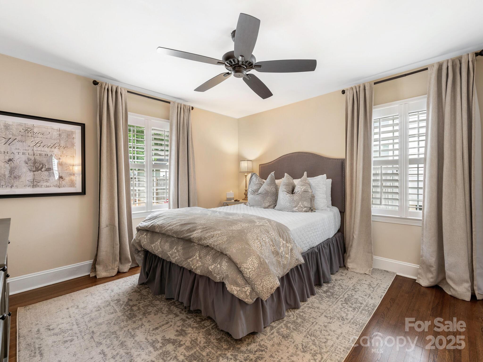 4346 Walker Road Charlotte, NC 28211 - Photo 19 of 30 a bedroom with a bed a window and a painting on the wall