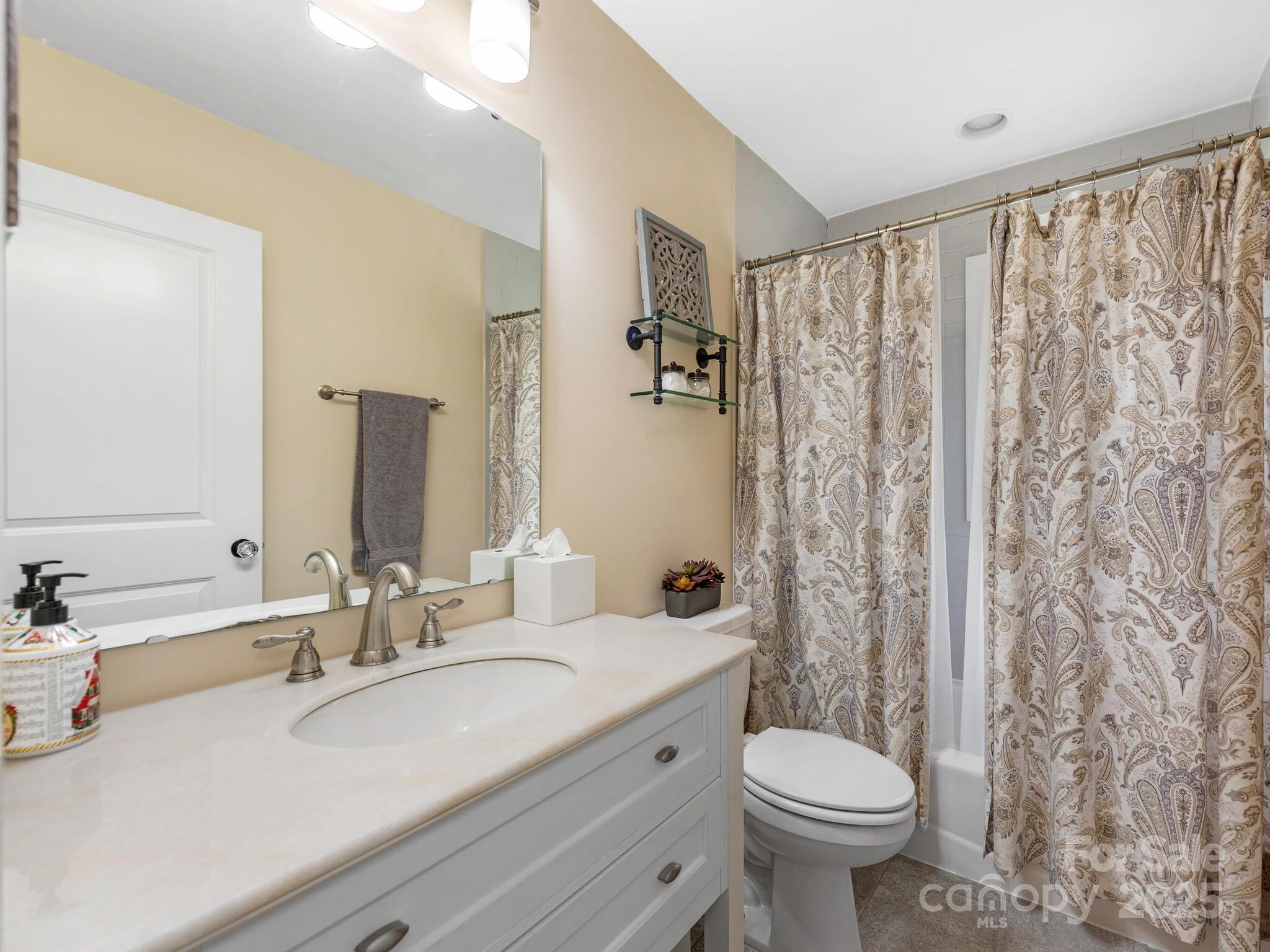 4346 Walker Road Charlotte, NC 28211 - Photo 21 of 30 a bathroom with a sink toilet and shower