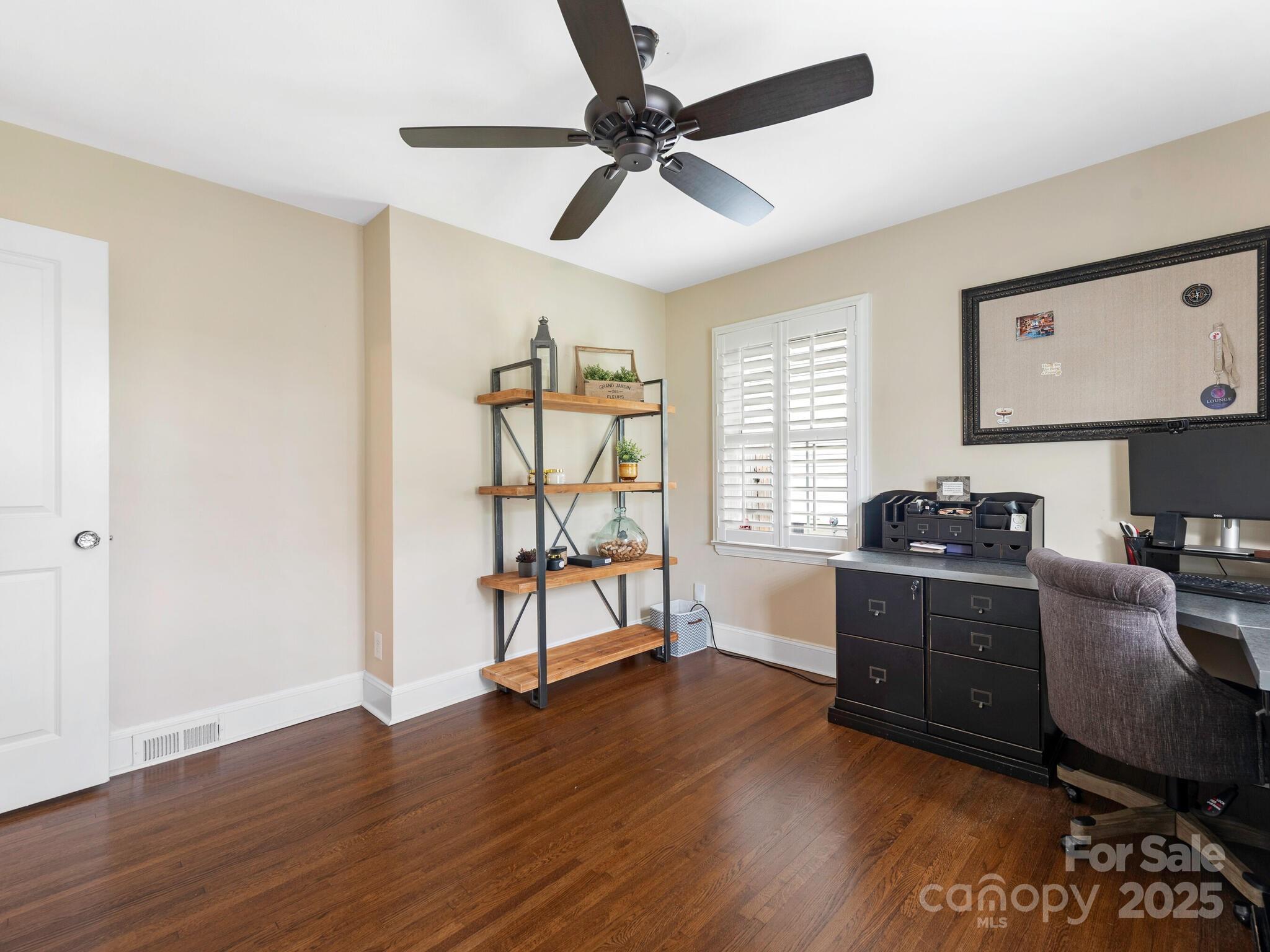 4346 Walker Road Charlotte, NC 28211 - Photo 23 of 30 a kitchen with wooden floors and stainless steel appliances