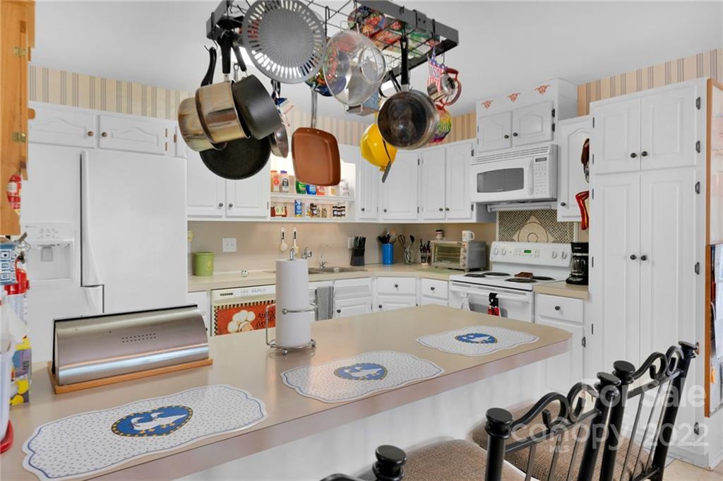 1414 Lighthouse Avenue Fort Mill, SC 29708 - Photo 11 of 47 a kitchen with appliances cabinets and a table