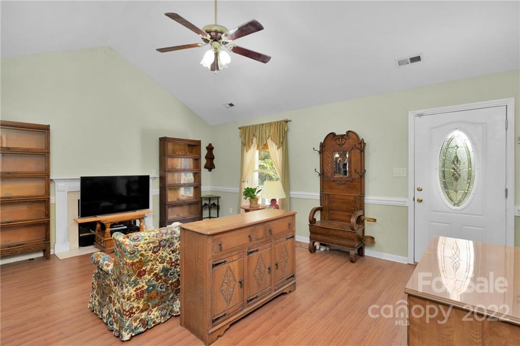 1414 Lighthouse Avenue Fort Mill, SC 29708 - Photo 15 of 47 a view of living room with furniture flat screen tv and wooden floor