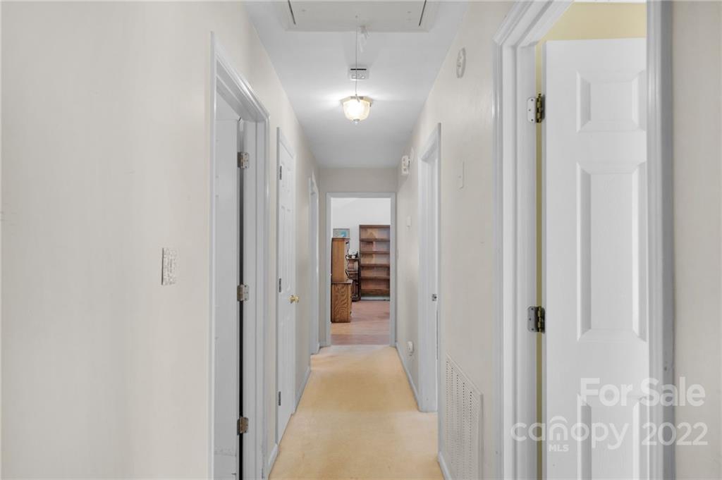 1414 Lighthouse Avenue Fort Mill, SC 29708 - Photo 25 of 47 a view of a hallway with wooden shelves