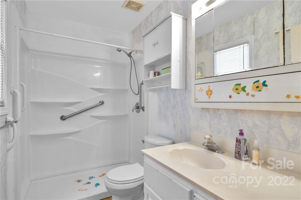 1414 Lighthouse Avenue Fort Mill, SC 29708 - Photo 27 of 47 a bathroom with a sink toilet vanity and shower