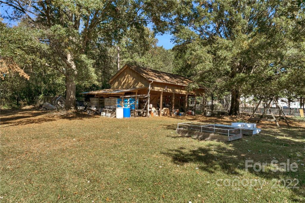 1414 Lighthouse Avenue Fort Mill, SC 29708 - Photo 37 of 47 a view of a house with a yard and sitting area