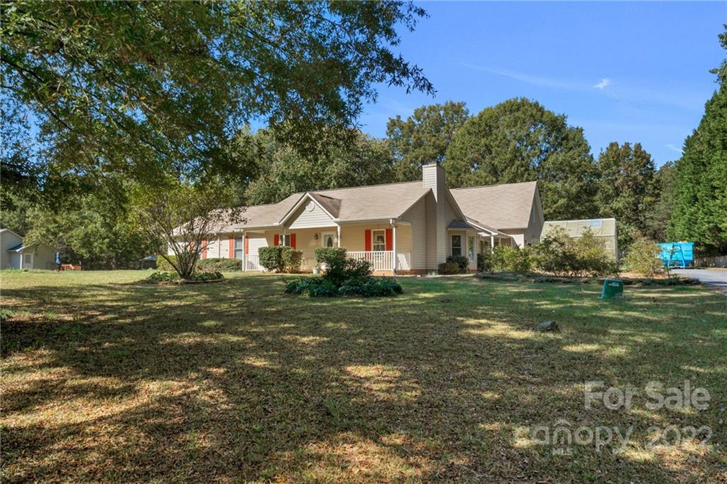 1414 Lighthouse Avenue Fort Mill, SC 29708 - Photo 47 of 47 a view of a white house with a yard