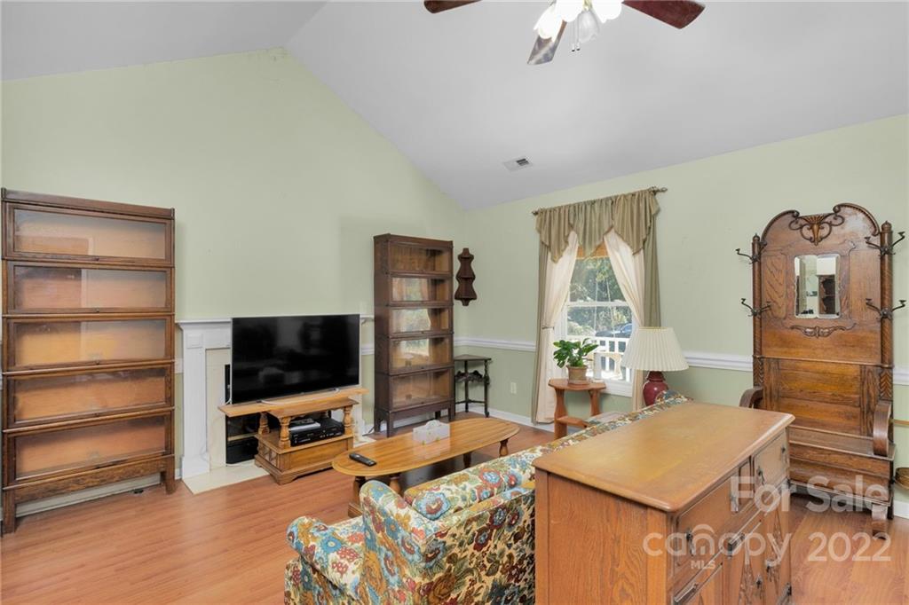 1414 Lighthouse Avenue Fort Mill, SC 29708 - Photo 9 of 47 a living room with furniture and a flat screen tv