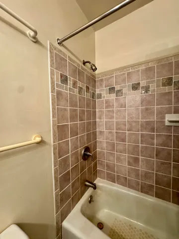 a bathroom with a shower and a bathtub