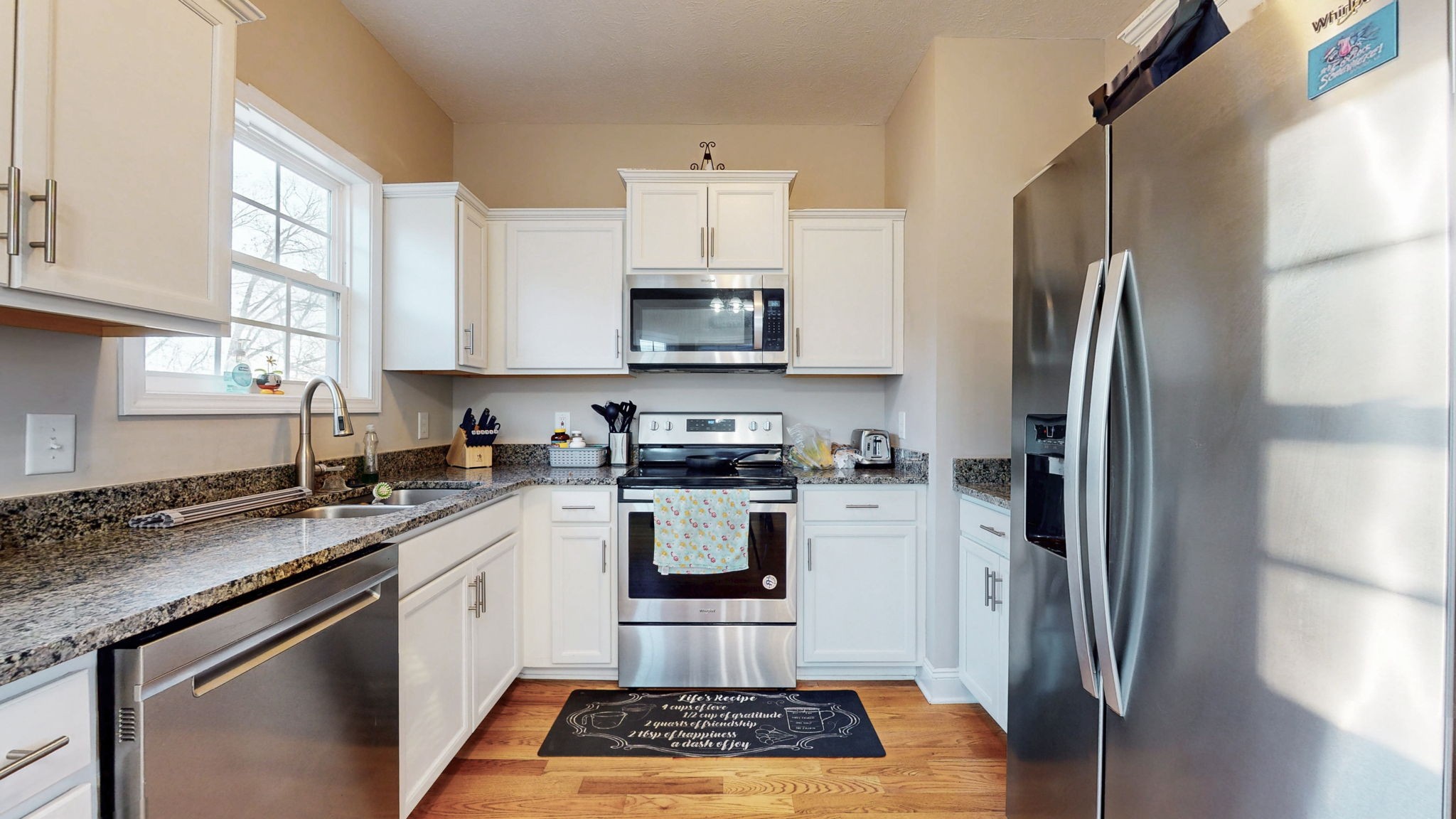 375 Misty Drive Pleasant View, TN 37146 - Photo 3 of 12 a kitchen with a sink stove and refrigerator