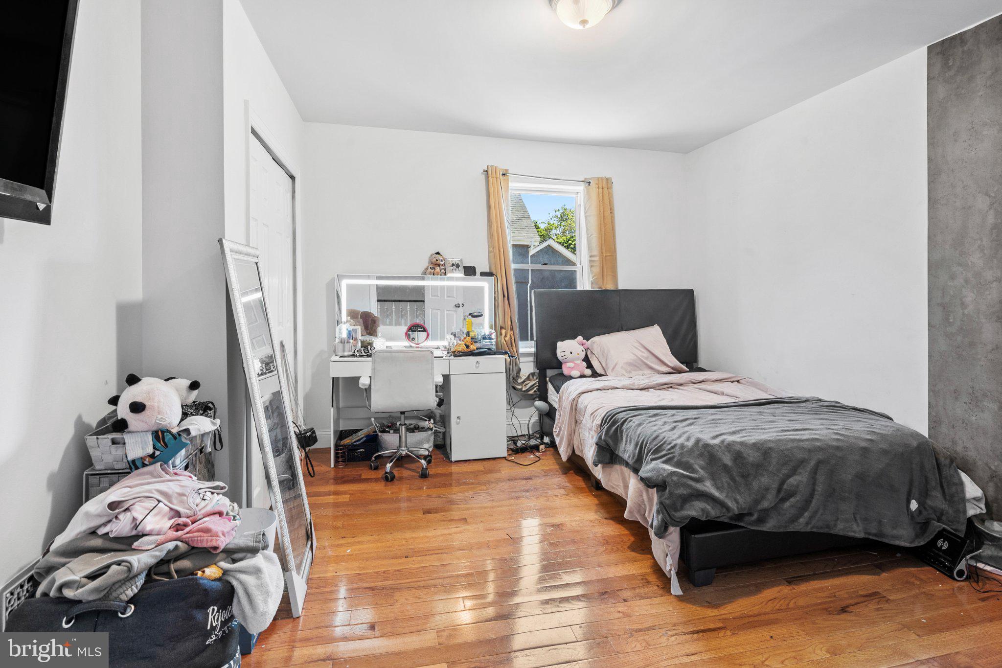 242 Church Road Elkins Park, PA 19027 - Photo 11 of 29 Cozy bedroom with warm wooden floors.