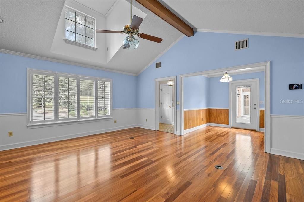2545 Crooked Creek Point Road Middleburg, FL 32068 - Photo 26 of 54 a view of an empty room with a window and wooden floor