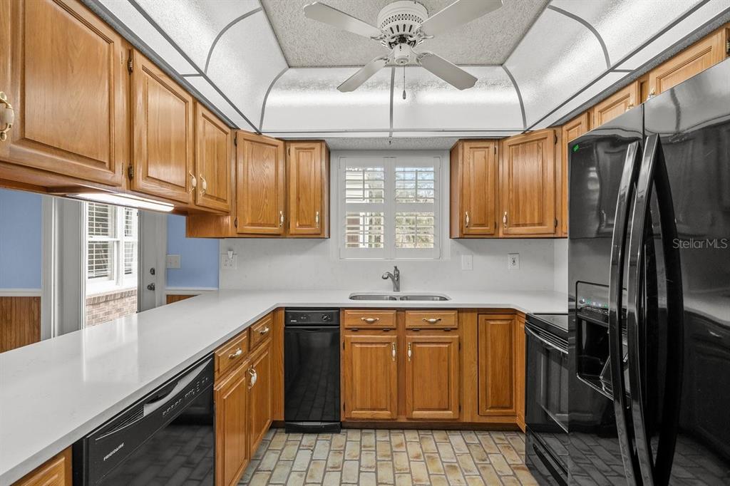 2545 Crooked Creek Point Road Middleburg, FL 32068 - Photo 29 of 54 a kitchen with stainless steel appliances granite countertop a sink a stove and cabinets