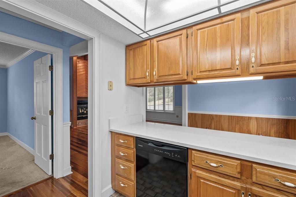 2545 Crooked Creek Point Road Middleburg, FL 32068 - Photo 30 of 54 a kitchen with stainless steel appliances granite countertop cabinets and a refrigerator