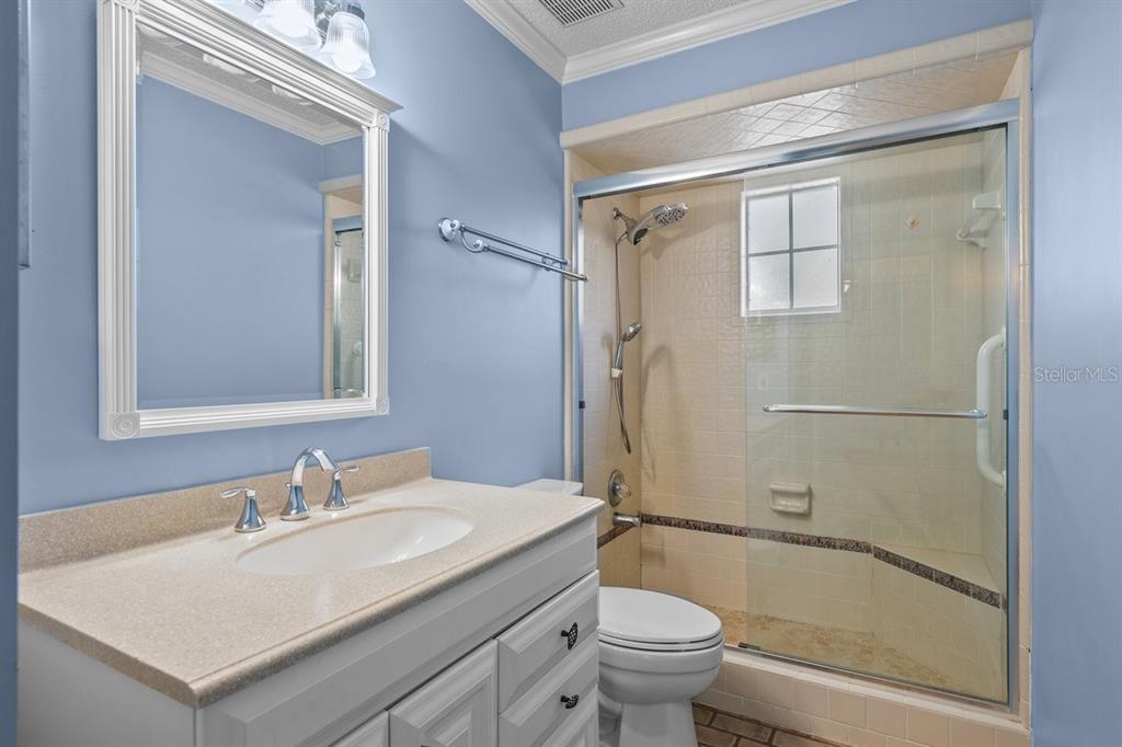 2545 Crooked Creek Point Road Middleburg, FL 32068 - Photo 35 of 54 a bathroom with a sink toilet and shower