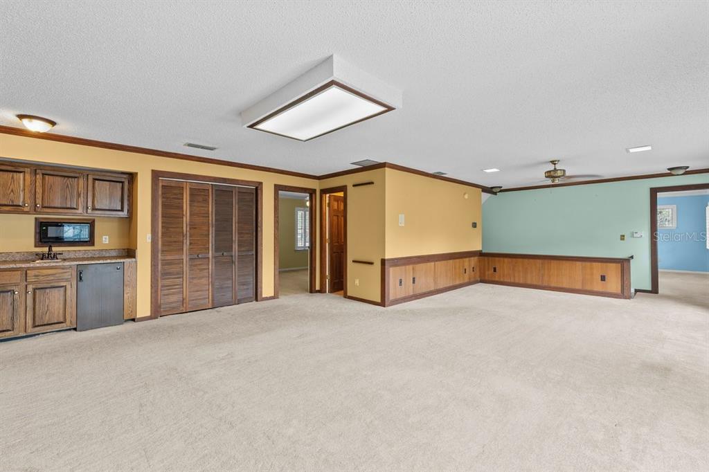 2545 Crooked Creek Point Road Middleburg, FL 32068 - Photo 40 of 54 a view of an empty room with a window and kitchen view