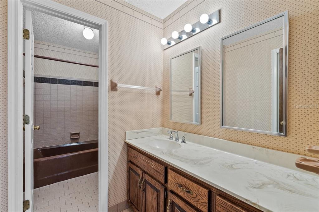 2545 Crooked Creek Point Road Middleburg, FL 32068 - Photo 43 of 54 a bathroom with a sink double vanity and a mirror