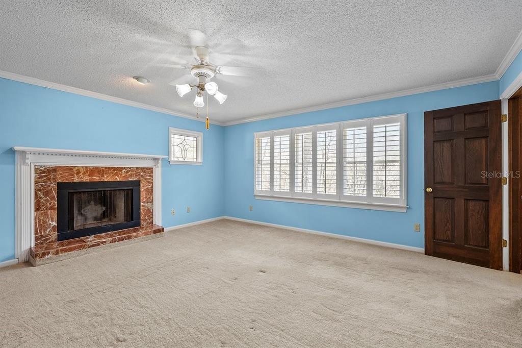 2545 Crooked Creek Point Road Middleburg, FL 32068 - Photo 47 of 54 a view of an empty room with a fireplace and a window